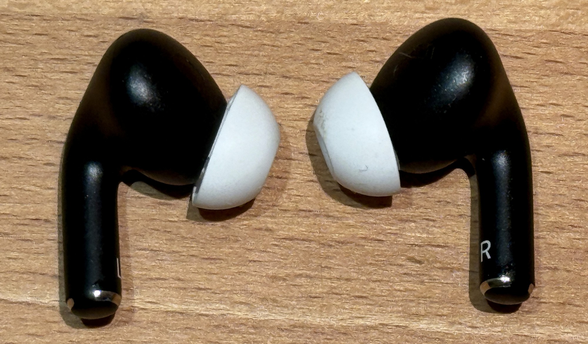 AirPods Pro 2 in a custom dark-blue finish; not a standard Apple color