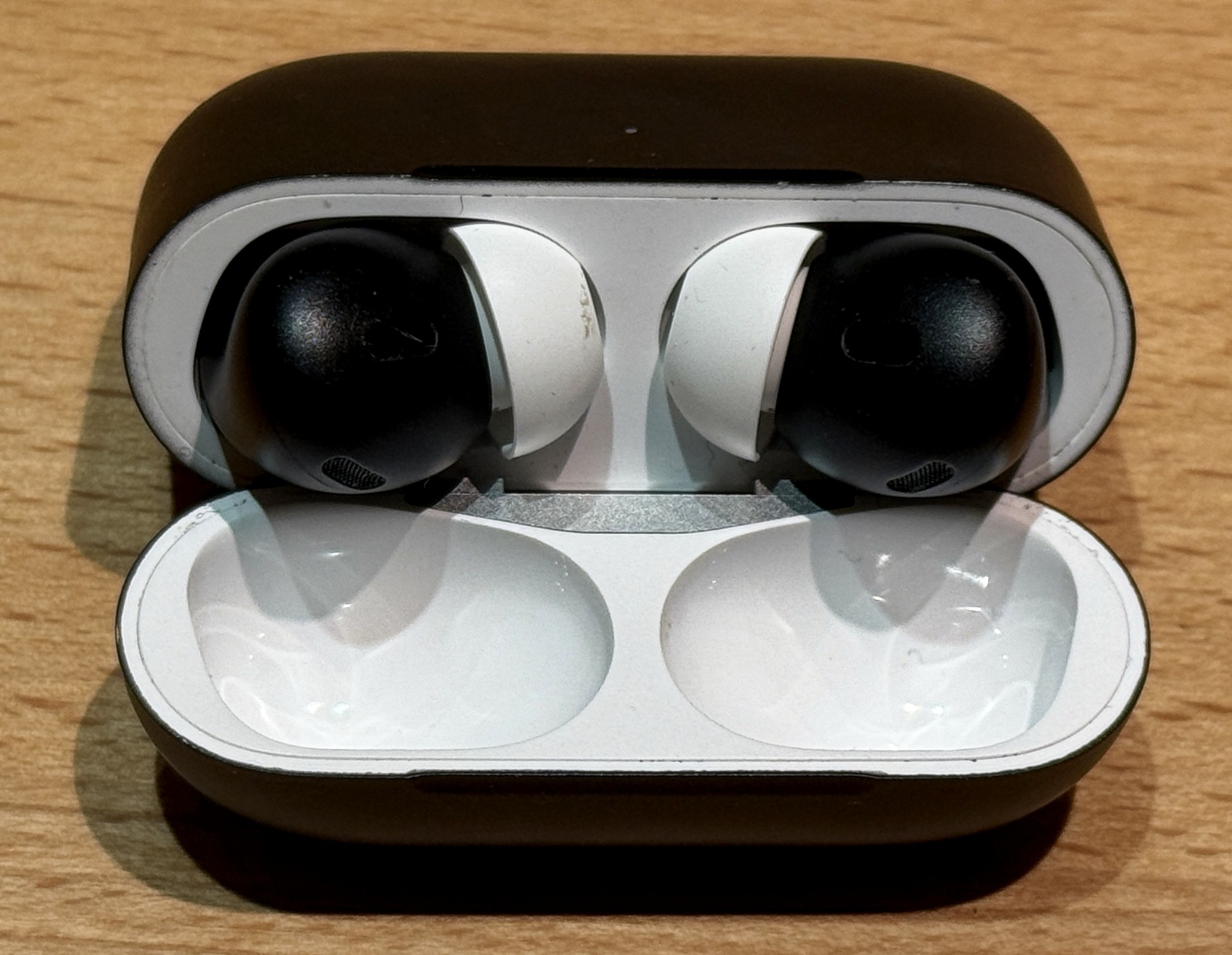 AirPods Pro 2 in a custom dark-blue finish; not a standard Apple color