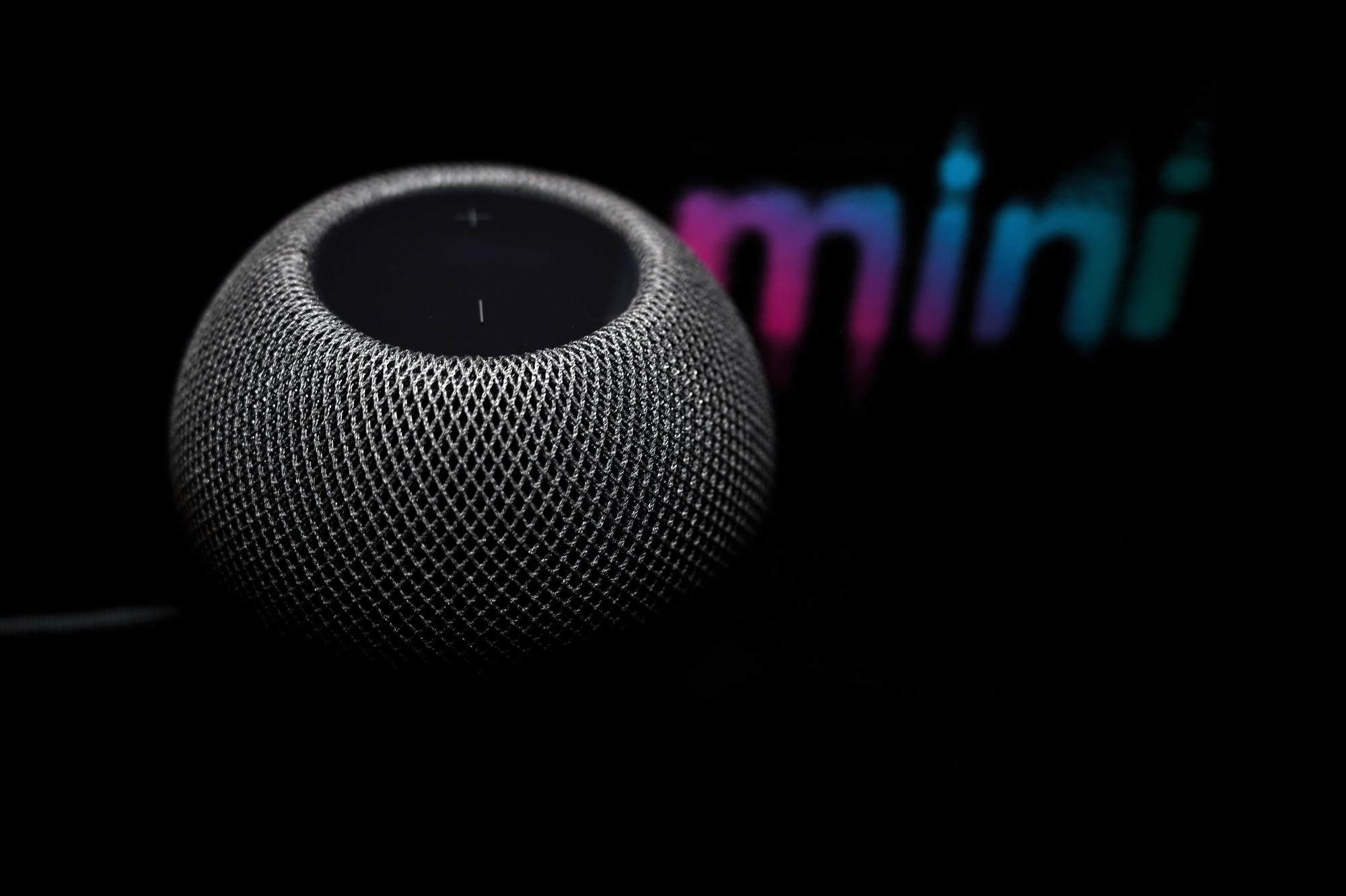 HomePod mini in Space Gray with illuminated top